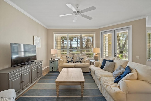 living room with ornamental molding, a healthy amount of sunlight, ceiling fan, and french doors