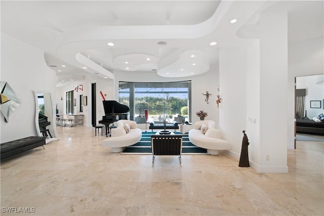 living room featuring a towering ceiling