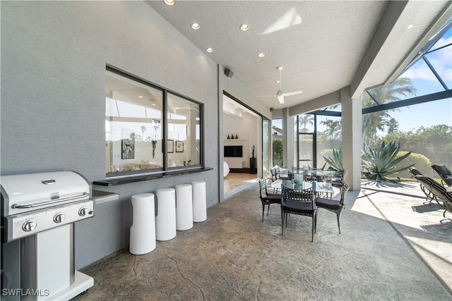 sunroom / solarium featuring lofted ceiling