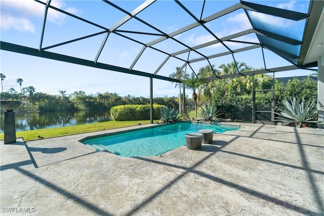 view of swimming pool with a water view, a patio, and a lanai