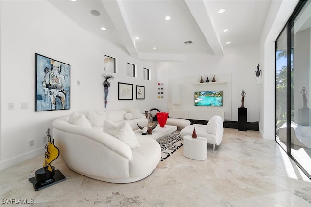 living room with beamed ceiling