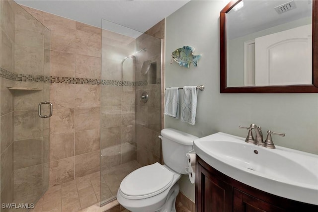 bathroom featuring vanity, toilet, and walk in shower