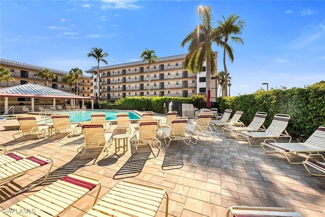 view of patio / terrace featuring a community pool and a gazebo