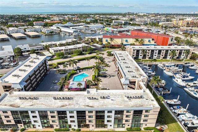 birds eye view of property with a water view