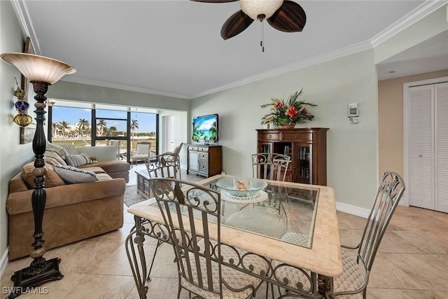 tiled dining room with crown molding and ceiling fan