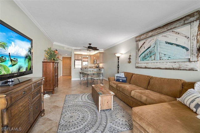 living room with light tile patterned floors, ornamental molding, and ceiling fan