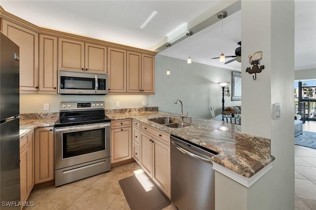 kitchen featuring sink, crown molding, kitchen peninsula, stainless steel appliances, and light stone countertops