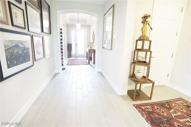 hall with light hardwood / wood-style flooring