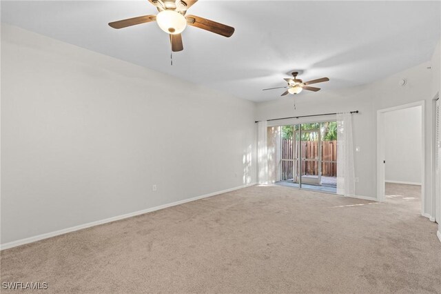 unfurnished room featuring ceiling fan and carpet flooring