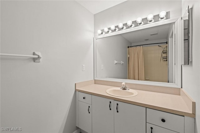 bathroom featuring vanity and a shower with curtain