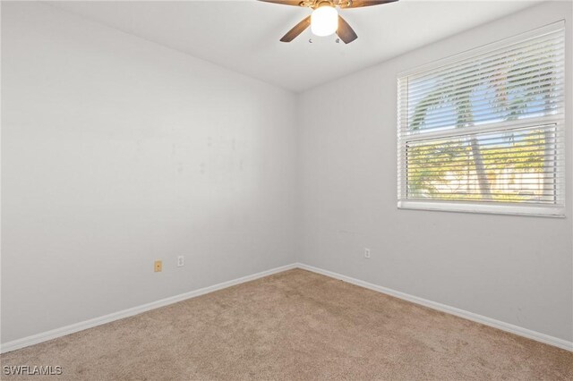 empty room with carpet floors and ceiling fan