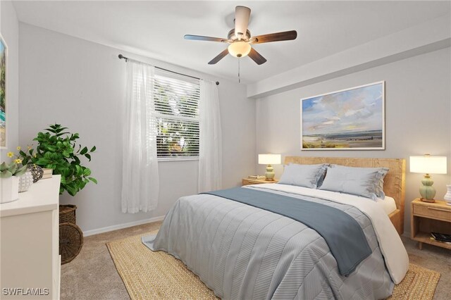 carpeted bedroom featuring ceiling fan