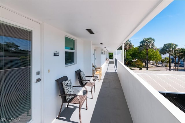 view of patio / terrace with a balcony