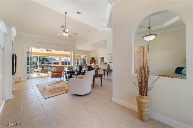 living room with vaulted ceiling, light tile patterned floors, ceiling fan, and crown molding