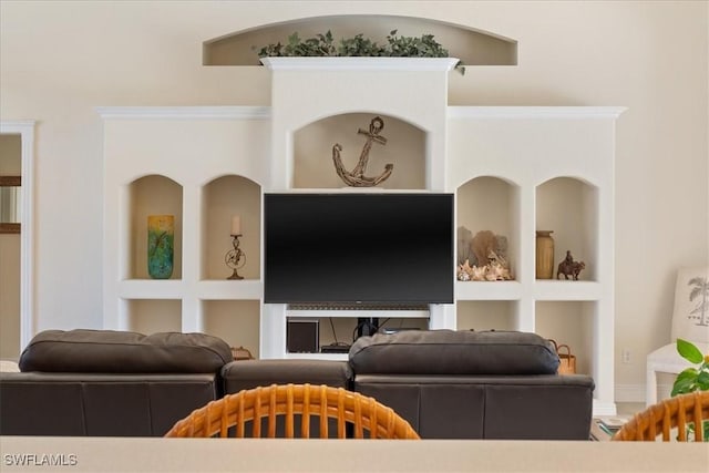 living room with ornamental molding