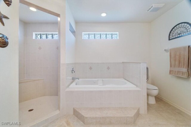 bathroom with toilet, separate shower and tub, and tile patterned flooring