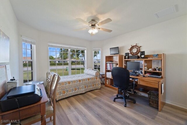 bedroom featuring ceiling fan and hardwood / wood-style floors