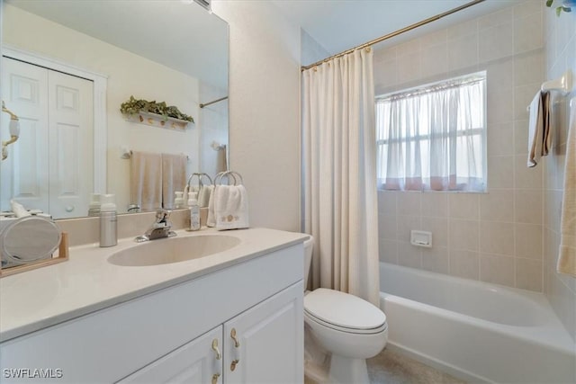 full bathroom with shower / bath combination with curtain, vanity, and toilet