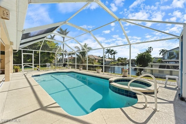 view of swimming pool featuring an in ground hot tub, a patio, glass enclosure, and a water view