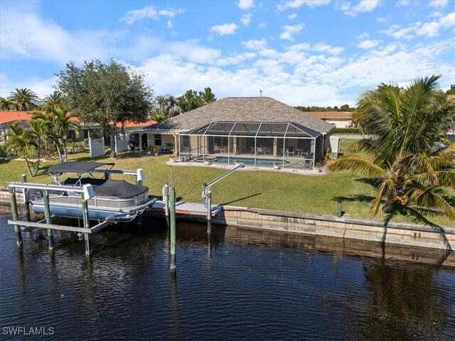 view of dock with a lanai, a lawn, and a water view