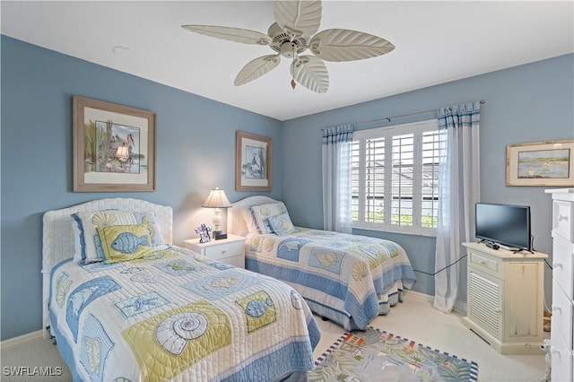 carpeted bedroom with ceiling fan