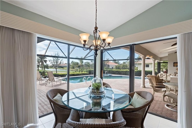 dining area featuring light tile patterned flooring and lofted ceiling