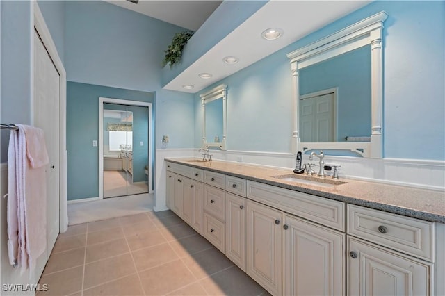 bathroom featuring tile patterned flooring and vanity