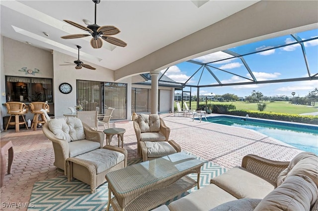 view of patio with ceiling fan, an outdoor hangout area, and a lanai