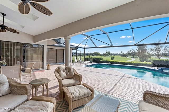 view of pool with ceiling fan, a lanai, an outdoor hangout area, and a patio area