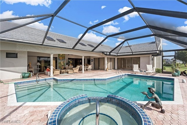 view of pool featuring an in ground hot tub, an outdoor living space, a lanai, and a patio area