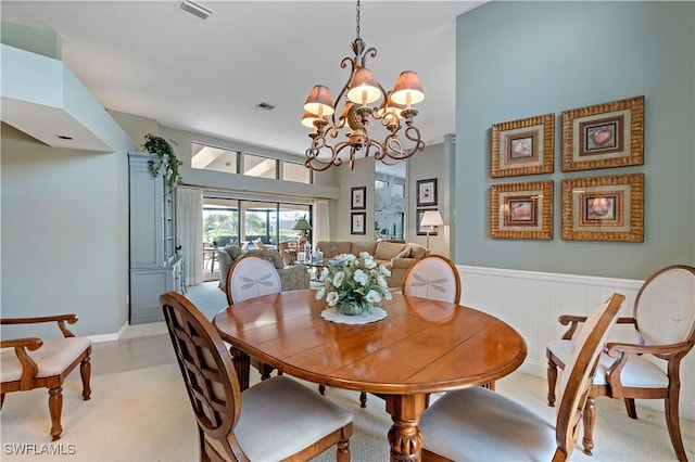 dining space with an inviting chandelier