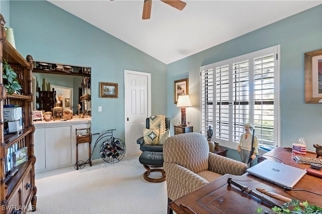 office area with ceiling fan, lofted ceiling, and light carpet