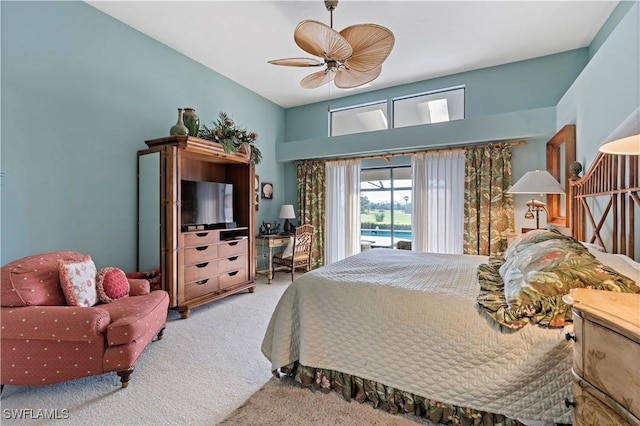 carpeted bedroom featuring access to outside and ceiling fan