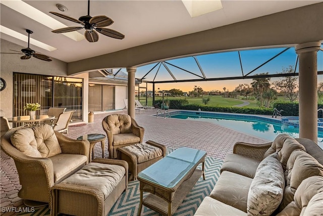 exterior space with outdoor lounge area, ceiling fan, and a lanai