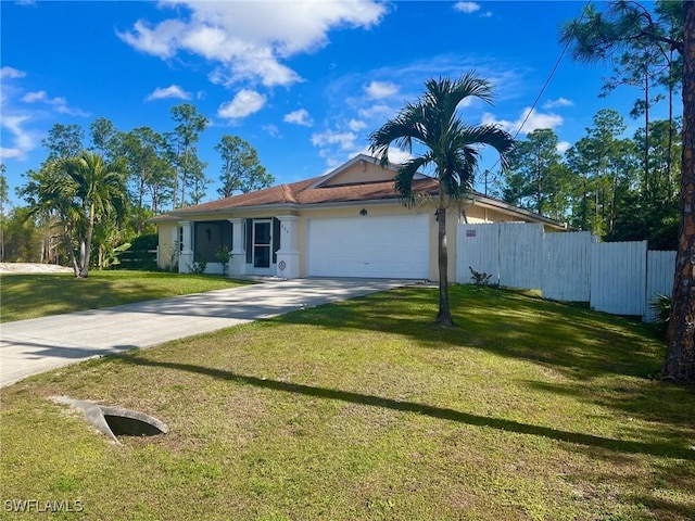 view of front of home featuring a garage and a front lawn