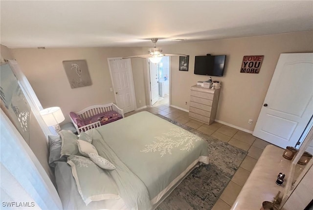 bedroom featuring tile patterned floors and baseboards