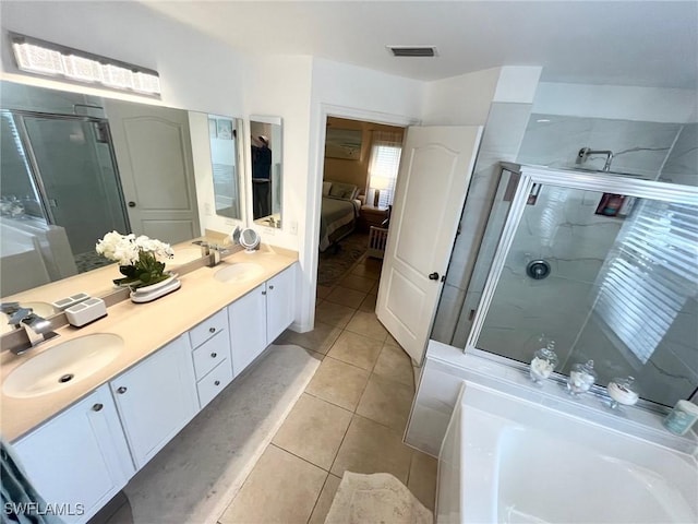 bathroom with tile patterned flooring, visible vents, a shower stall, a garden tub, and a sink