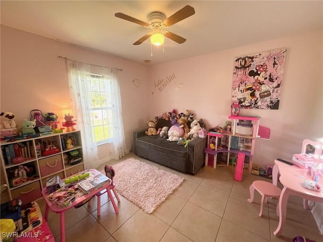 game room featuring ceiling fan and tile patterned flooring