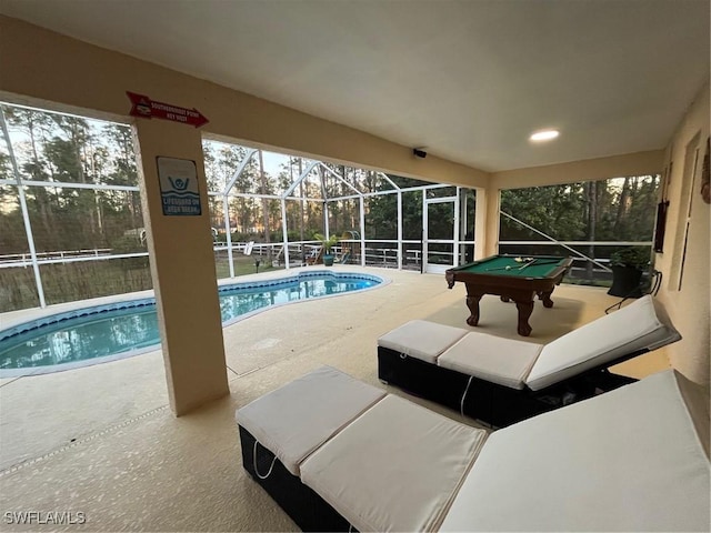 pool with a patio and a lanai