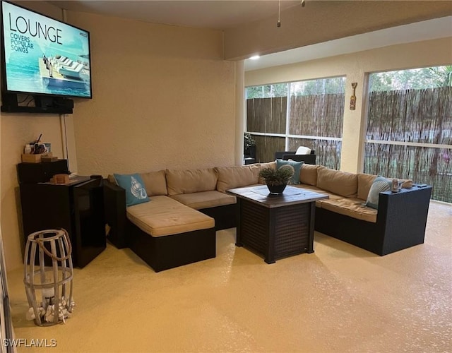 living room featuring a textured wall