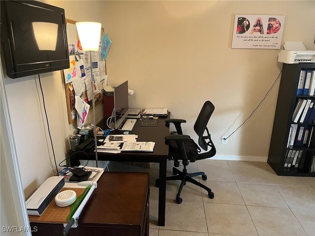 822 Johns Ave, Lehigh Acres, FL 33972 - home office featuring light tile patterned floors and baseboards