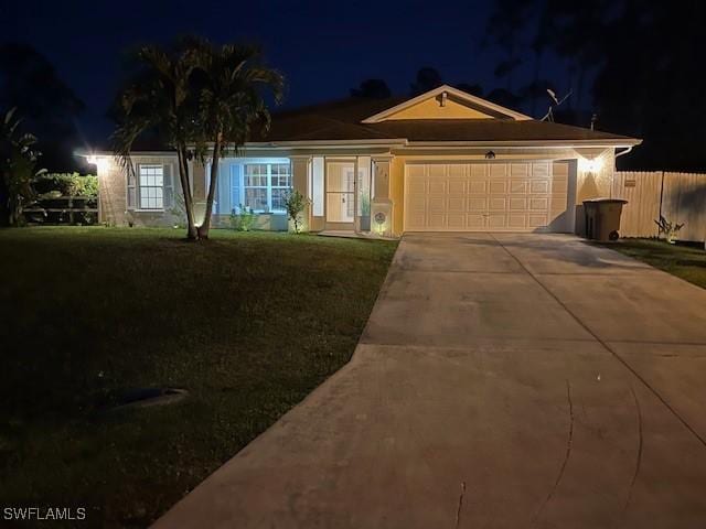822 Johns Ave, Lehigh Acres, FL 33972 - ranch-style house featuring an attached garage and driveway