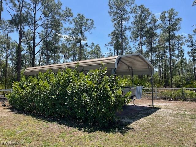 822 Johns Ave, Lehigh Acres, FL 33972 - view of yard with a detached carport