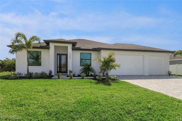 view of front of property featuring a front lawn and a garage