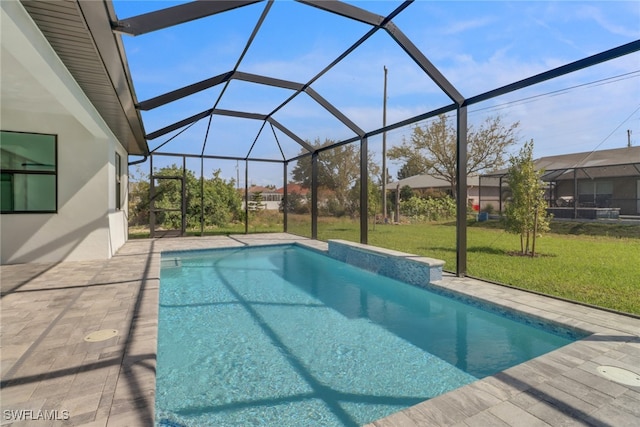 view of swimming pool with glass enclosure, a patio, and a lawn