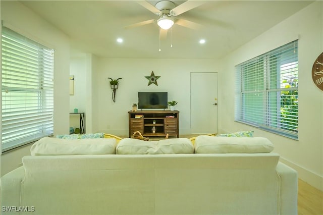 living room featuring ceiling fan