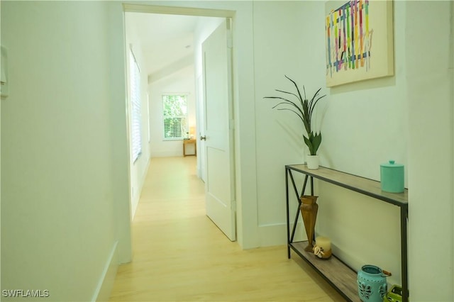 corridor with light wood-type flooring