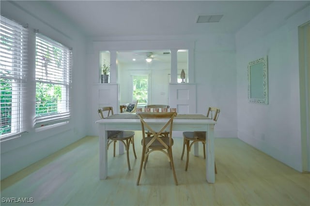 dining area featuring plenty of natural light and light hardwood / wood-style floors