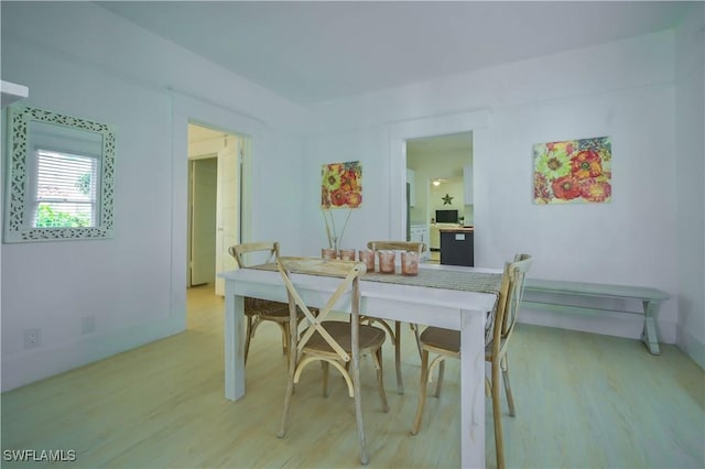 dining area with light wood-type flooring