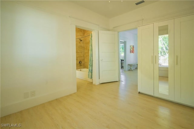 spare room featuring light hardwood / wood-style flooring